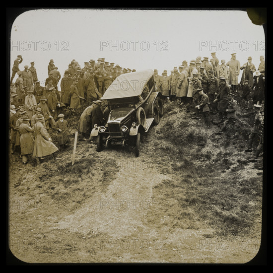 A six-wheeled car, possibly an early Morris Commercial 6x4, driving down a slope..., 1926-1929.  Creator: Norman Kingsley Harrison.