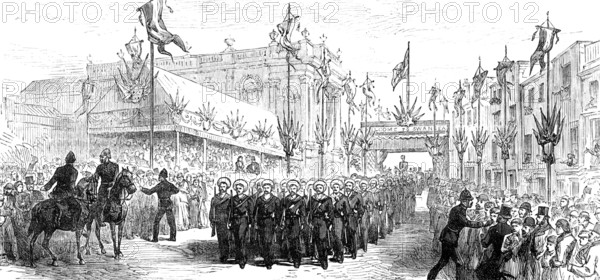 The Royal Visit to Swansea: the march past of volunteers at the Townhall, 1881. Creator: Unknown.