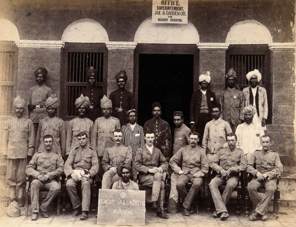 Staff who work in the jail or gardens for the Karachi Plague Committee, India, 1897. Creator: Unknown.