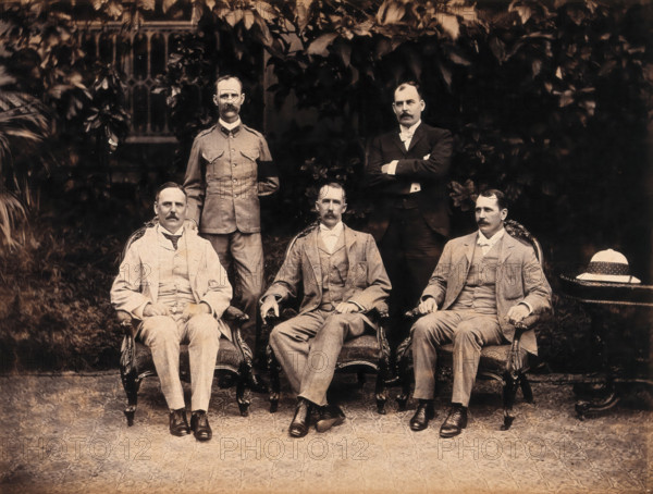 The five members of the Bombay Plague Committee, three sitting, two standing, 1897. Creator: Captain C Moss.