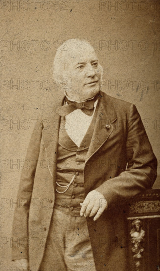 An unidentified man leaning on a cabinet, c1880s. Creator: Frederick Mulnier.