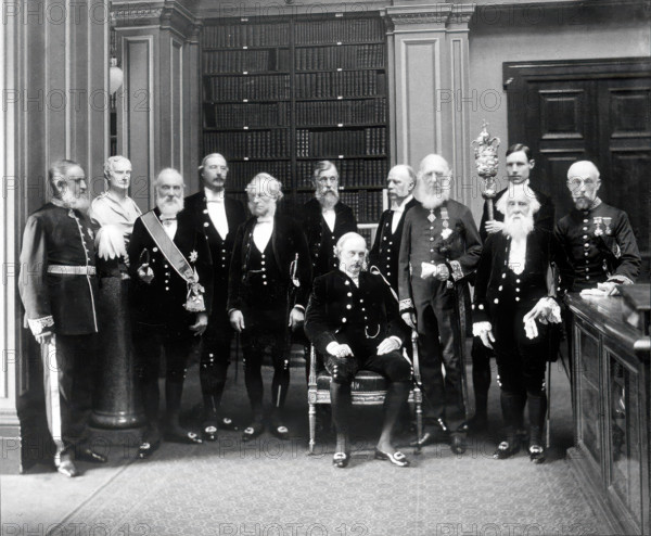 Fellows of the Royal Society: Sir John Evans, bust of Sir Isaac Newton, Lord Kelvin, RB Clifton... Creator: Mayall.