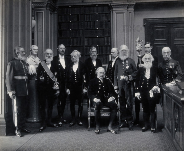 Fellows of the Royal Society: Sir John Evans, bust of Sir Isaac Newton, Lord Kelvin, RB Clifton... Creator: Mayall.