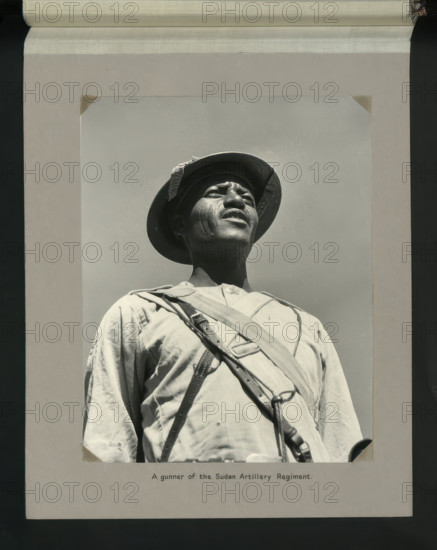 A gunner of the Sudan Artillery Regiment, 1964. Creators: Colonial Office, Unknown.