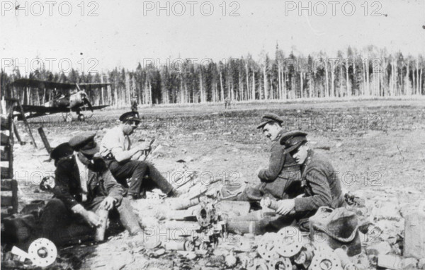Royal Engineers Special Brigade officers and Thomas Davies’ servant assembling M bombs..., 1919. Creator: Unknown.