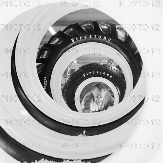 Row of Firestone tyres at the Royal Smithfield Show at Earls Court, London, 1956. Creator: John Gay.