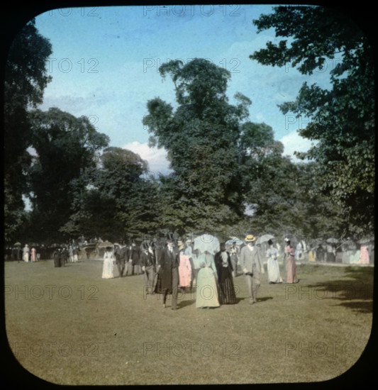 Well dressed ladies and gentlemen attending a sports day...Eton College, Windsor, 1889. Creator: Henry Taunt.