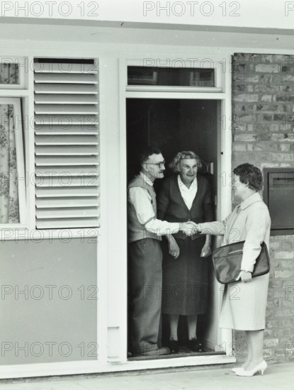 16 Candy Street, Poplar, London: elderly couple greet Welfare Officer, 1962. Creator: Unknown.