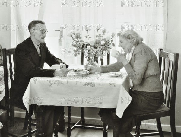 16 Candy Street, Poplar, London: elderly couple in a new flat, 1962. Creator: Unknown.