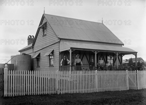 Unknown family portrait and family with monkey on verandah, c1900s. Creator: Robert Augustus Henry L'Estrange.