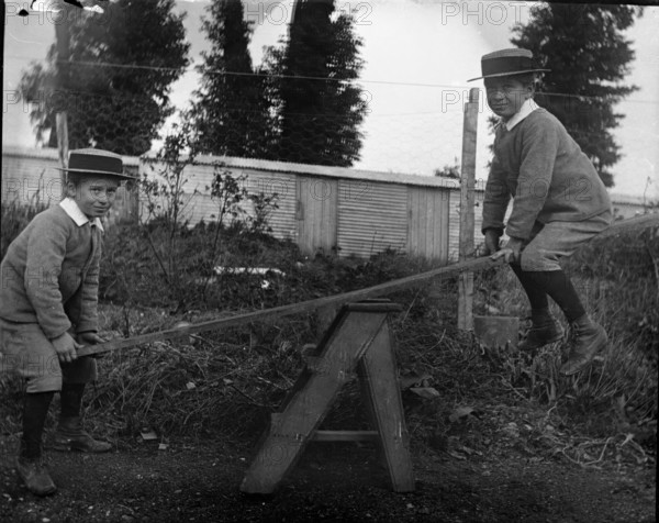 Frederick Robert L'Estrange on a see saw, c1895. Creator: Robert Augustus Henry L'Estrange.