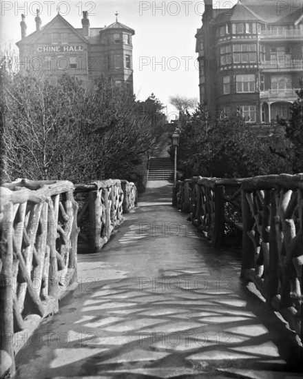 Chine Hall and White Lodge Hotel from the Rustic Bridge, Boscombe Chine and Gardens..., 1900. Creator: Robert Augustus Henry L'Estrange.
