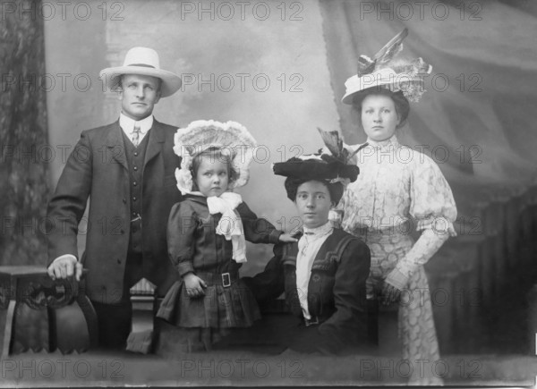 Portrait of unknown family, 1906. Creator: Robert Augustus Henry L'Estrange.