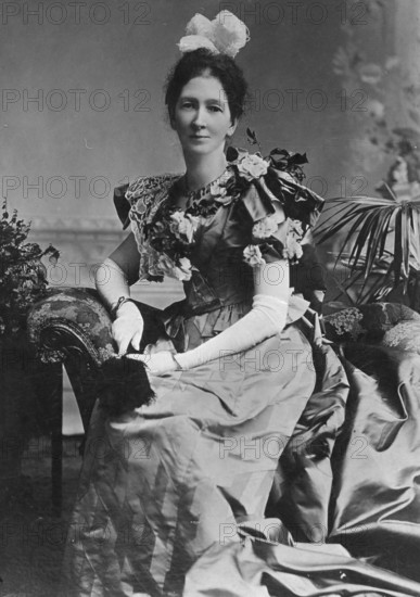 Portrait of unknown lady in a party dress, c1900s. Creator: Robert Augustus Henry L'Estrange.