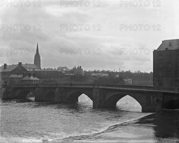 Chester weir and Old Dee Bridge on River Dee with Chester Cathedral in the background, 1902. Creator: Robert Augustus Henry L'Estrange.