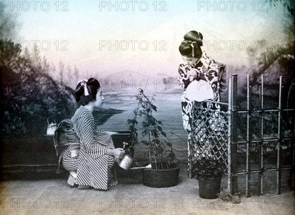 Japanese girls playing in a garden, 1880. Creator: Unknown.