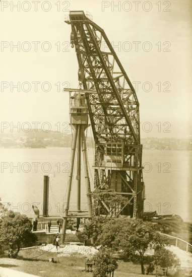 Erection of H.M.A.S. Sydney's mast, Bradleys Head, 1934. Creator: Unknown.