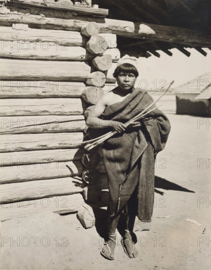 Untitled (man holding bow and arrow, New Mexico), c.between 1920 and 1940. Creator: Guillermo Bravo.