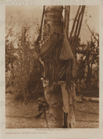 Offerings in the Sun Lodge, Piegan, 1926. Creator: Edward Sheriff Curtis.