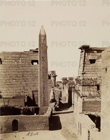 Entrance to Temple of Luxor with Modern Mud-Brick Houses. Luxor, East Bank, between 1860 and 1903. Creator: Antonio Beato.