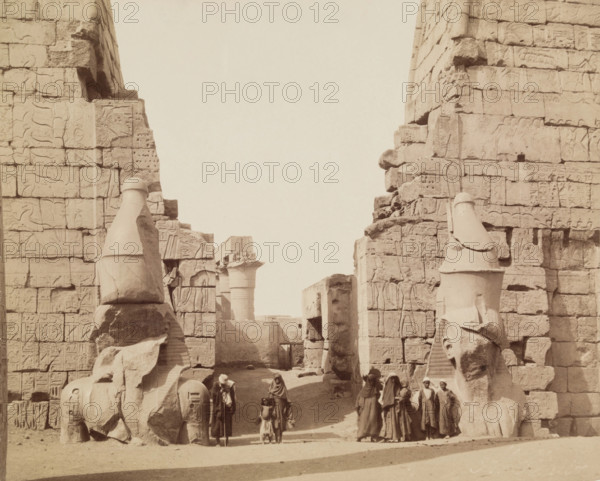 Entrance to Temple of Luxor with Colossal Statues of Luxor, East Bank Ramesses, between 1860 & 1903. Creator: Antonio Beato.