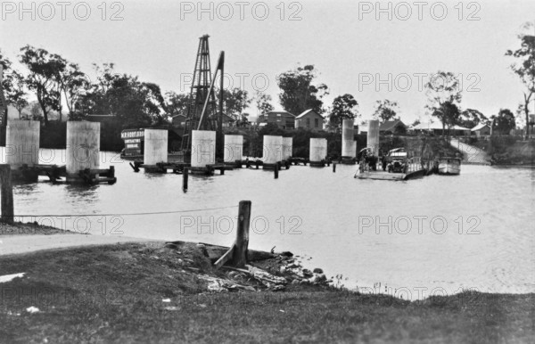 Coomera River Ferry and construction of the road bridge, 1929. Creator: Jack Bain.