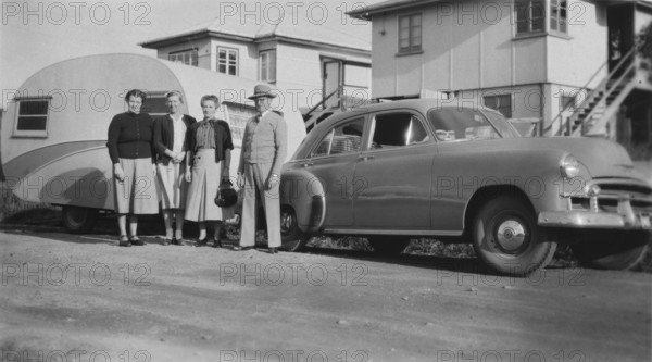 Car with caravan, Mooloolaba, Queensland, 1952. Creator: Jack Bain.