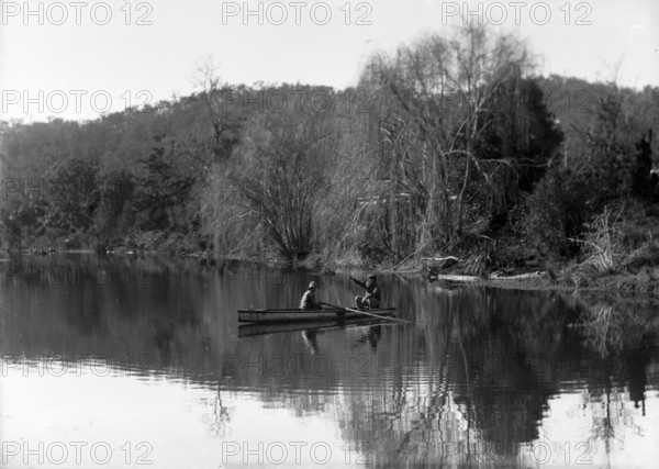 Frederick George Walker and boy in a row boat (possibly Coomera River), c1900s.. Creator: Robert Augustus Henry L'Estrange.