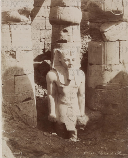 Colossal Statue of Ramesses II in the First Court of the Temple at Luxor, 19th century. Creator: Zangaki.