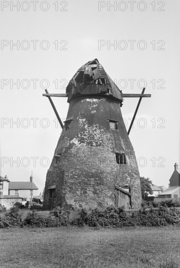 Exterior view of the derelict tower mill on Mill Green, Warboys, Cambridgeshire, 1936. Creator: HES Simmons.