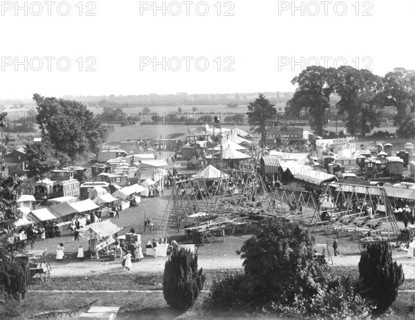 General view of Witney Fair from St Mary's Church tower, West Oxfordshire, Oxfordshire, 1860-1922. Creator: Henry Taunt.