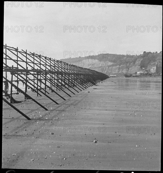 Looking south along a line of Admiralty scaffolding, Shanklin beach, Isle Of Wight, 1940-46.  Creator: George R Long.