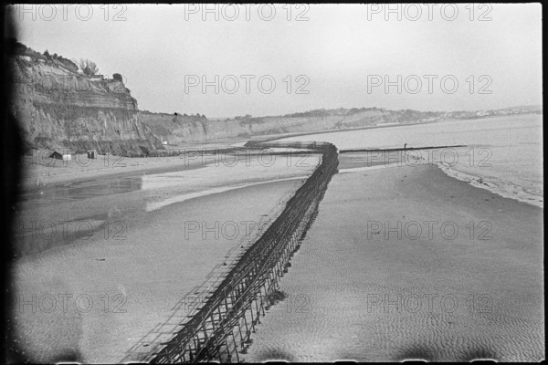 View looking north-east from Shanklin Beach, showing Admiralty scaffolding, Isle Of Wight, 1945. Creator: George R Long.
