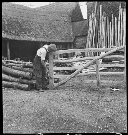Man making a field gate in the village of Aston, Cote, Shifford and Chimney, Oxfordshire, 1930-50. Creator: George R Long.