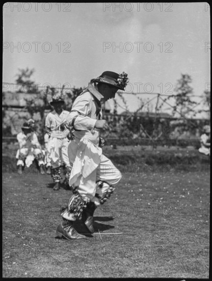 Bampton Morris troupe performing in a 'Pipe Dance', Bampton, West Oxfordshire, Oxfordshire, 1920-30. Creator: George R Long.