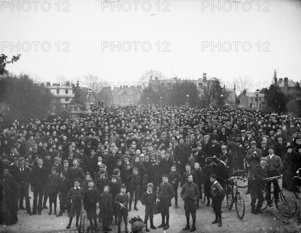 Large crowd on the bridge on May Morning to hear the college choir, Magdalen Bridge, Oxford, 1895. Creator: Henry Taunt.