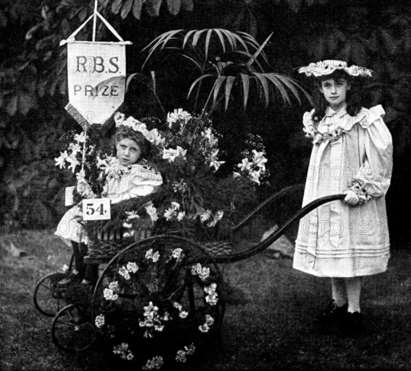 Children's Floral Fête, Royal Botanical Society's Gardens, Regent's Park: Mr. Garford's...cart, 1895 Creator: Russell & Sons.