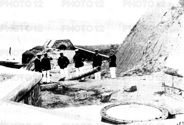 The Chinese Question: British officers viewing a dismounted gun...at Wei-Hai-Wei, 1895, (1898). Creator: James Fuller.