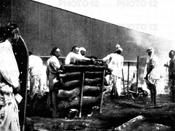 Scenes in Plague-Stricken Bombay: performing the final ceremonies at a high-caste funeral..., 1898. Creator: Gysi.