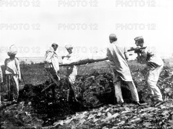 Scenes in Plague-Stricken Bombay: burying a poor man...[without funds for] cremation...., 1898. Creator: Gysi.