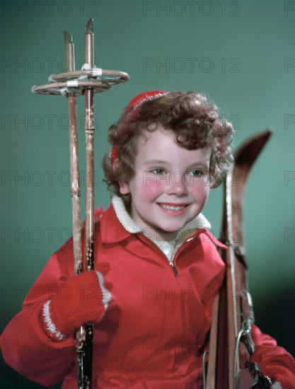 Young girl with cross-country ski equipment, c1955.  Creator: Arthur Charles Kirby Ware.