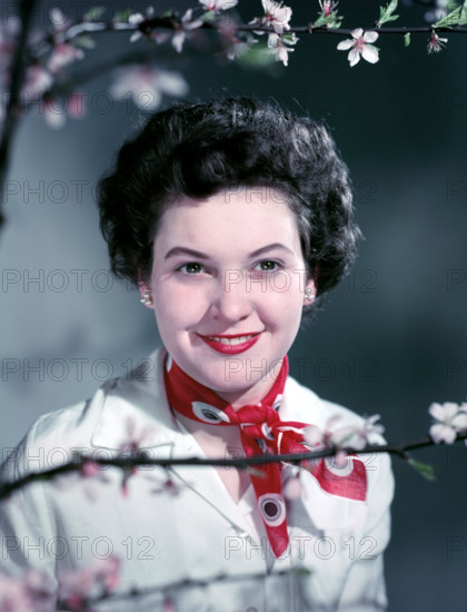 Woman wearing a red neck scarf, c1955.  Creator: Arthur Charles Kirby Ware.