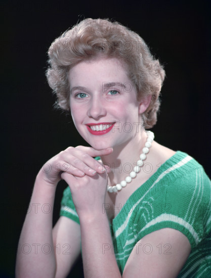 Portrait of a woman with green eyes, c1955.  Creator: Arthur Charles Kirby Ware.