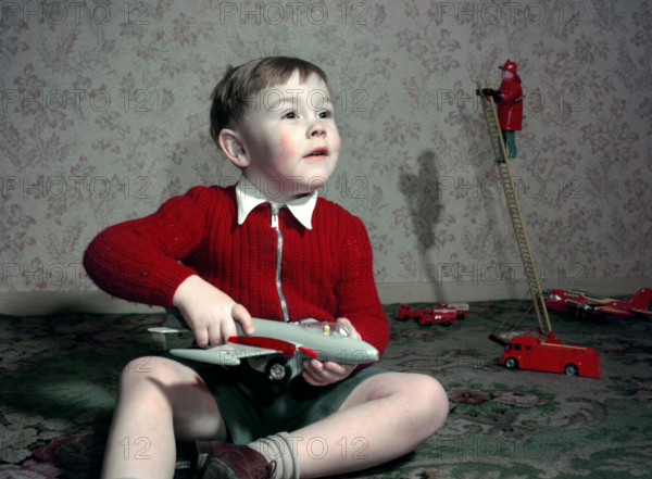 Boy playing with a toy aeroplane, c1960s. Creator: Arthur Charles Kirby Ware.