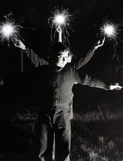 Children with fireworks, c1955. Creator: Arthur Charles Kirby Ware.