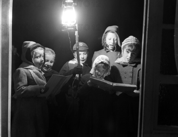 Carol singers, c1955. Creator: Arthur Charles Kirby Ware.
