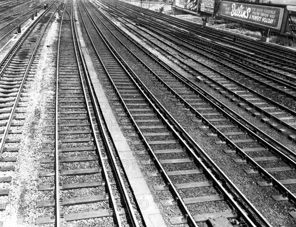 Railway tracks and Butlin's advertisement, c1955. Creator: Arthur Charles Kirby Ware.