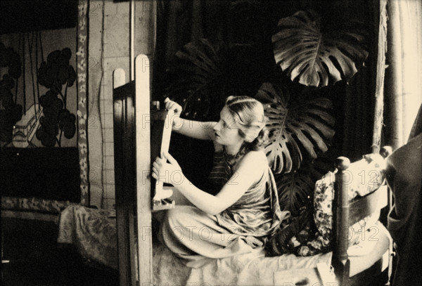 Lydia Delectorskaya preparing a canvas in Matisse’s studio, Place Charles-Félix, Nice, 1936. Creator: Matisse, Henri (1869-1954).