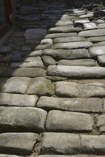 Remains of a Roman road next to the Valmardon Gate, paved with granite slabs, Toledo, Spain, 2022.  Creator: LTL.