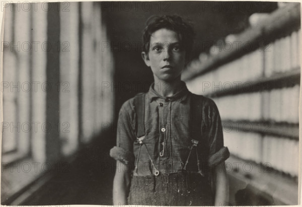 Jo Bodeon, a \back-roper\ in mule room. Chase Cotton Mill, Burlington, Vermont, 1909. Creator: Lewis Wickes Hine.